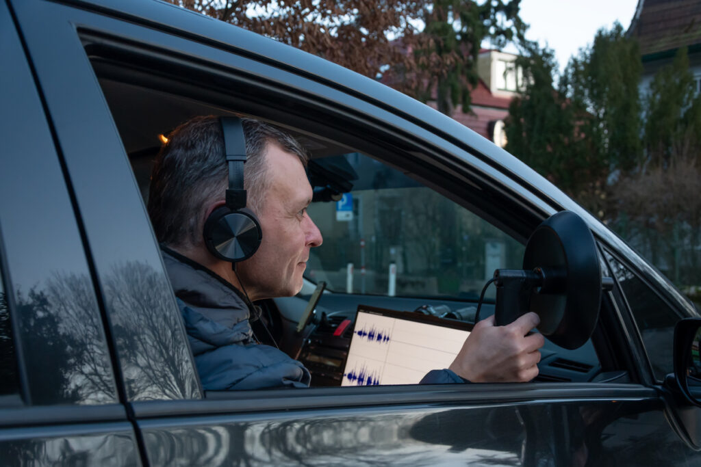 Licensed private investigator conducting physical surveillance in Michigan